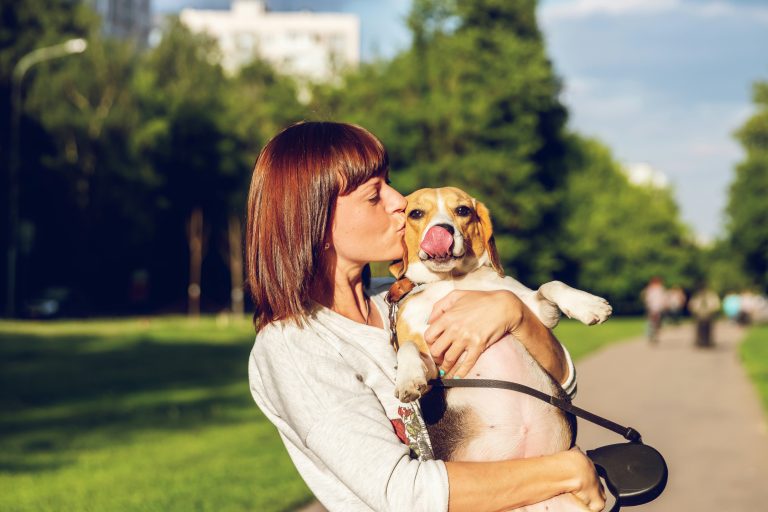 Atlanta pet parent with a happy dog after booking professional pet sitting and dog walking services